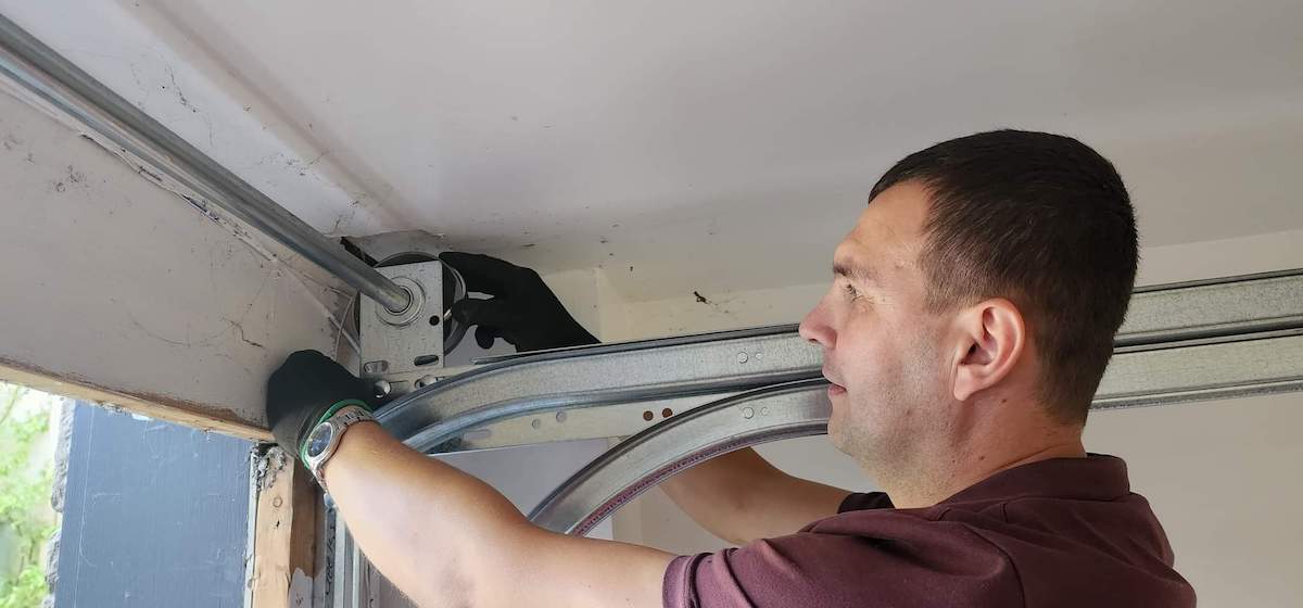 Maxim Garage Door technician performing Garage Door Cable Replacement in Dallas