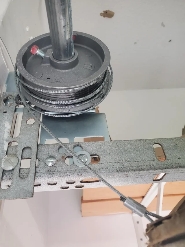 Maxim Garage Door technician performing Garage Door Drum Replacement in Dallas