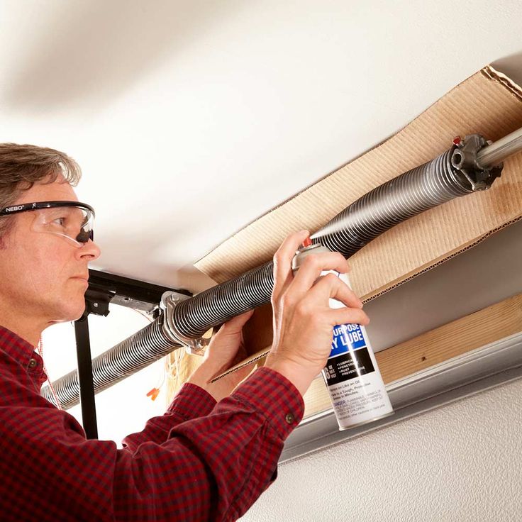 Maxim Garage Door technician performing Garage Door Maintenance in Dallas