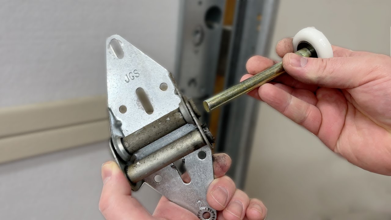 Maxim Garage Door technician performing Garage Door Rollers Replacement in Dallas