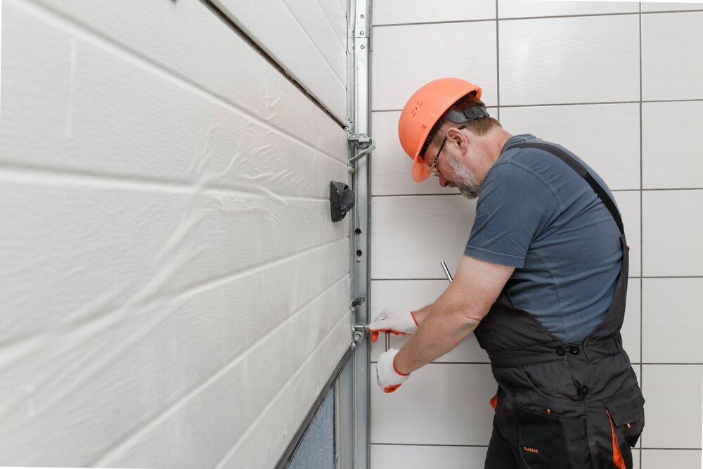 Maxim Garage Door technician installing Insulated Garage Doors in Dallas