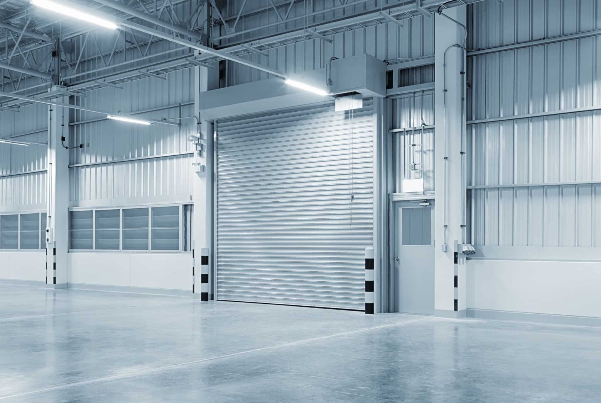 Maxim Garage Door technician installing Steel Garage Doors in Dallas