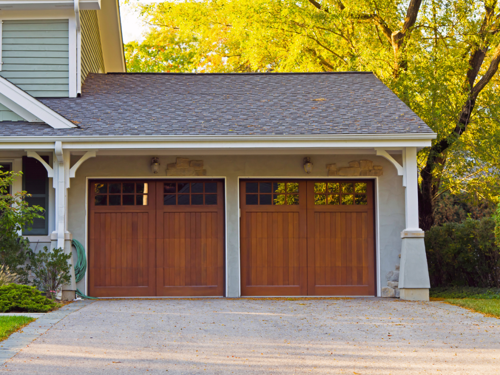 Maxim Garage Door technician installing Wood Garage Doors in Dallas